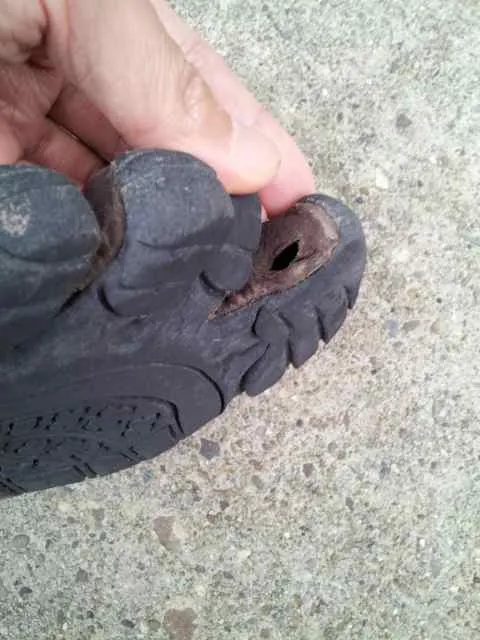 Hole in right shoe