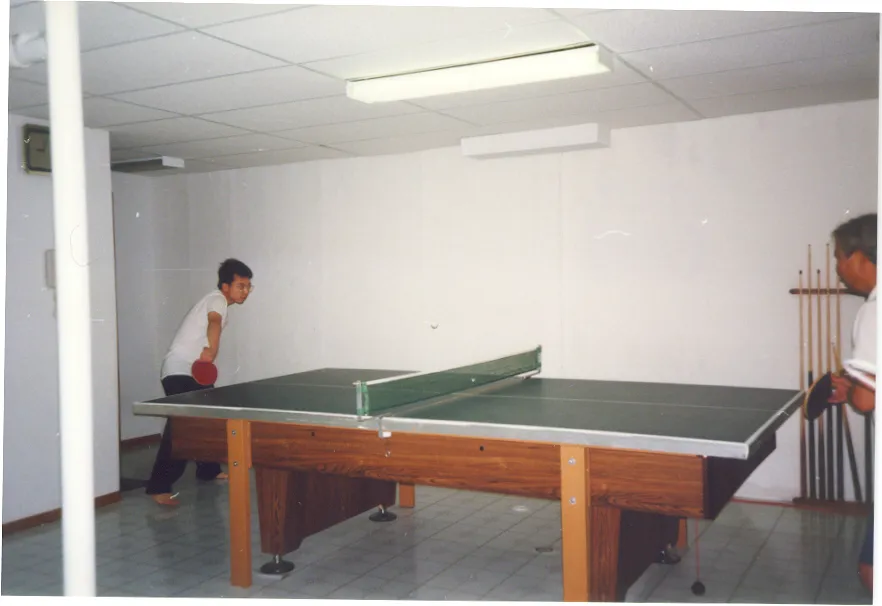 Franklin playing ping pong with father at home around 1993?