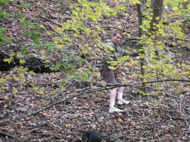 Guy and his dog climbing