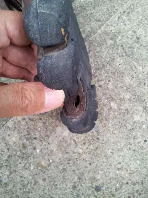 Hole in left shoe